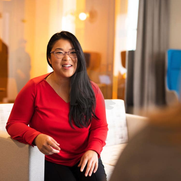 Woman on couch smiling