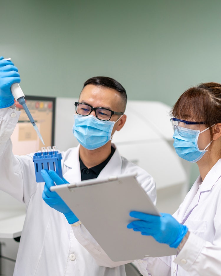 Two young doctors are in the hospital laboratory