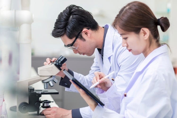 Female scientist working with test tubes in a lab